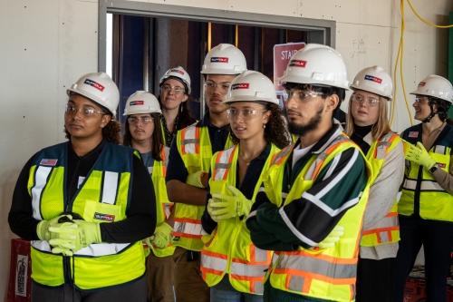 Students enjoying the construction site visit led by Suffolk Construction. 